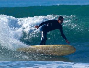 People Riding Surfboards with Vees in Their Bottoms...